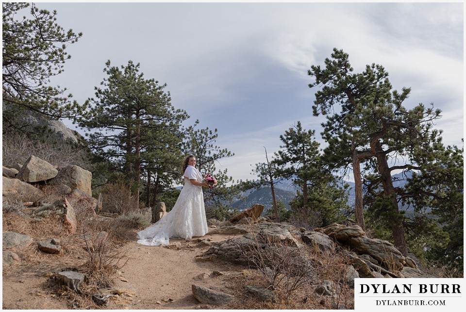 November elopement wedding in rocky mountain national park bride waiting for groom at the first look