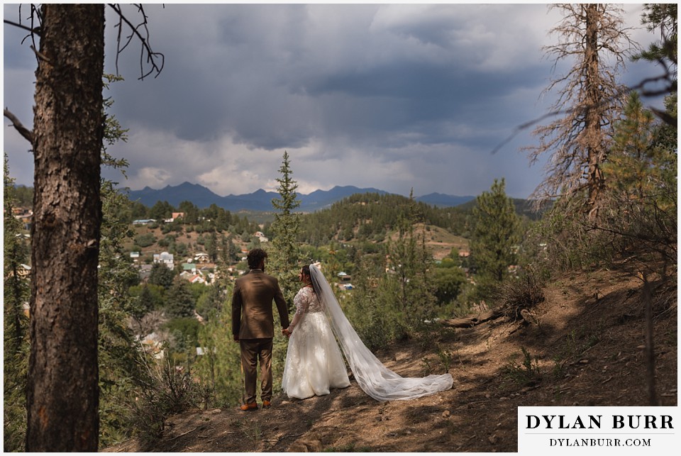 pagosa springs elopement bride and groom overlooking the town below