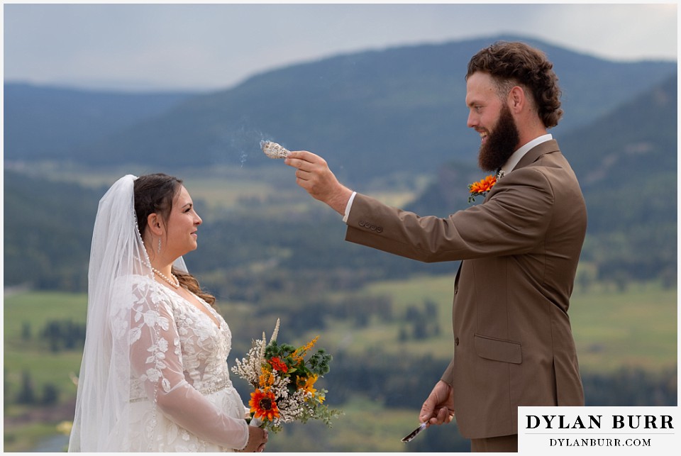 pagosa springs elopement groom blessing bride with sage