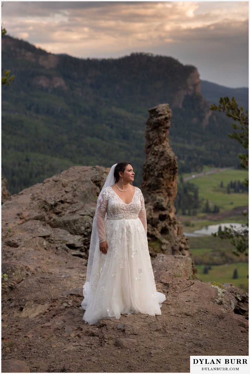 pagosa springs elopement bride alone on mountain cliff