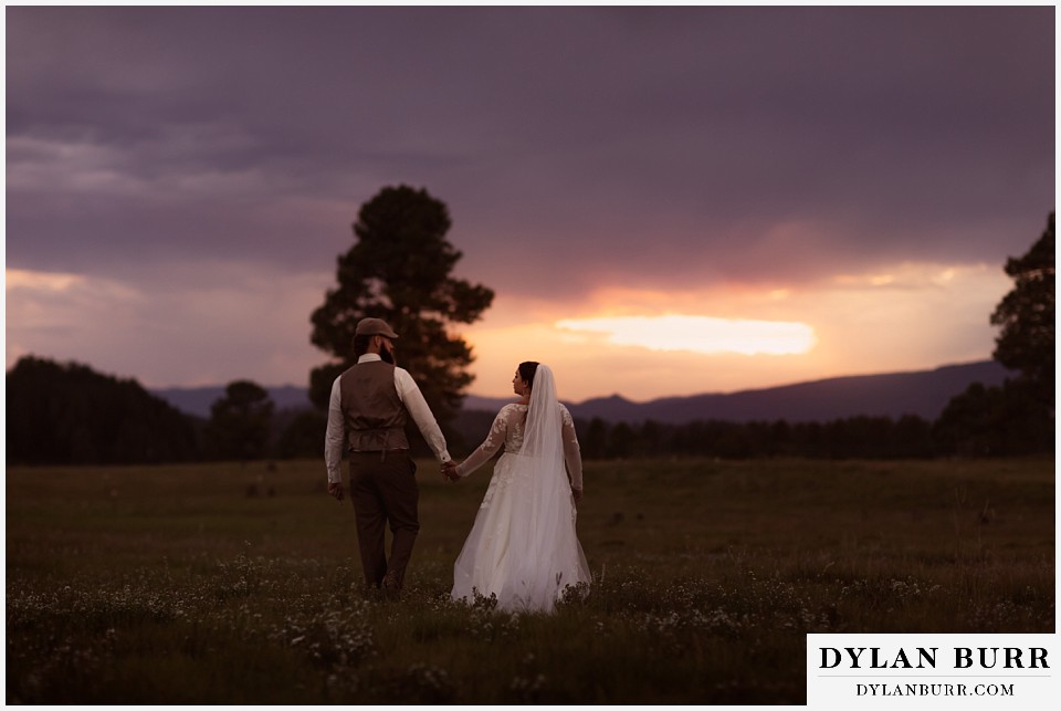 pagosa springs elopement couple at sunset in field