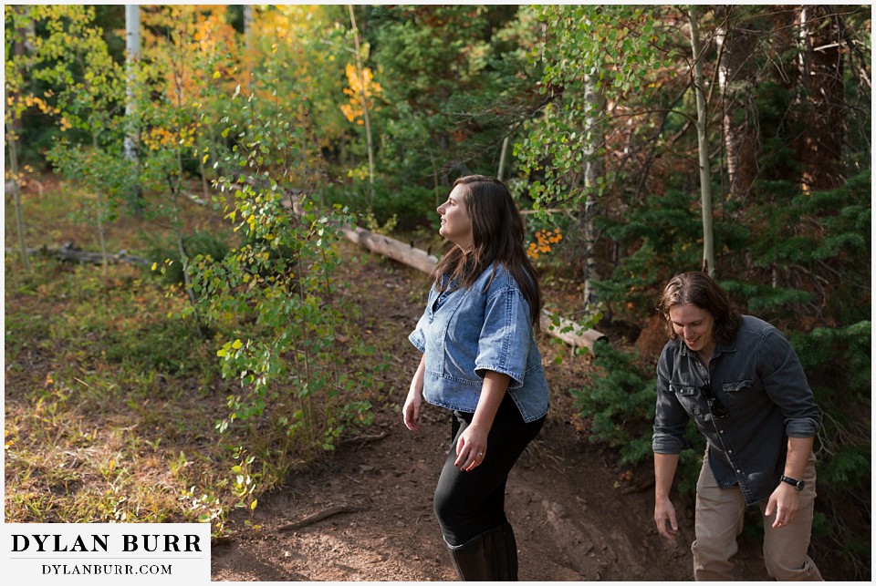 fall mountain engagement photo session enjoying the sunlight in the forest