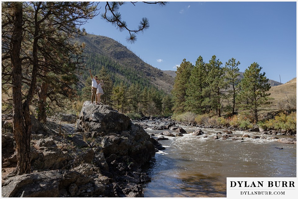 poudre canyon marriage proposal couple together on large rock