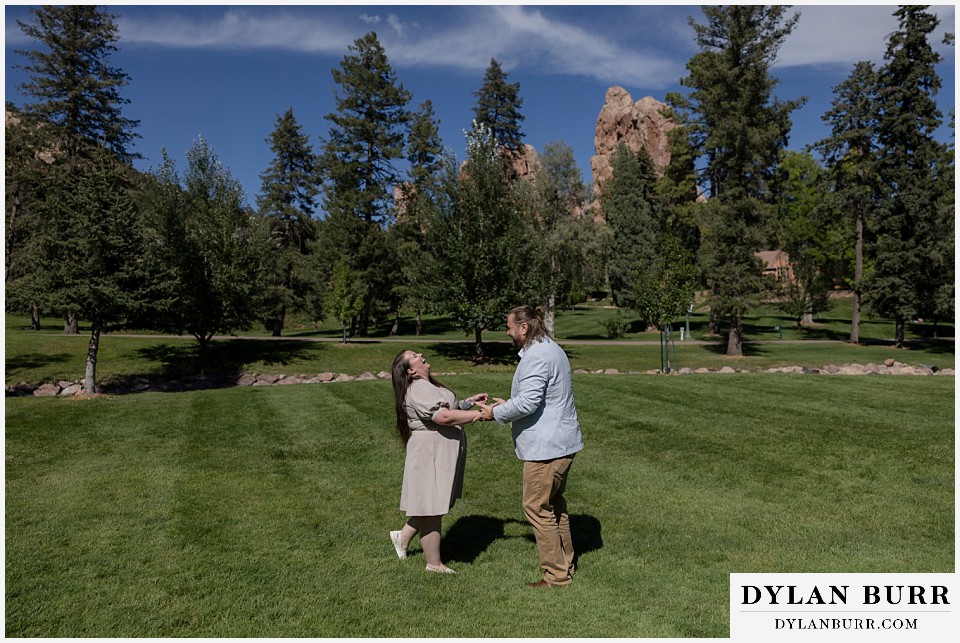proposal at glen eyrie castle colorado springs having fun on the lawn