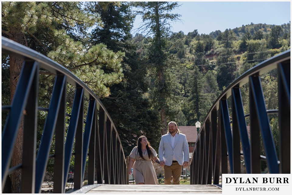 proposal at glen eyrie castle colorado springs bridge crossing