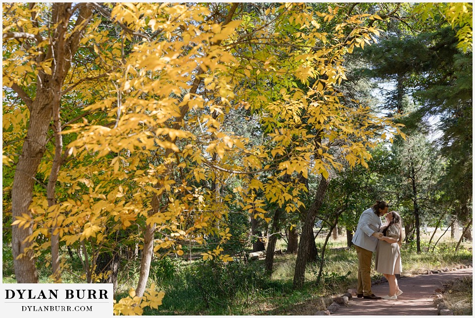 proposal at glen eyrie castle colorado springs dancing in the fall colors
