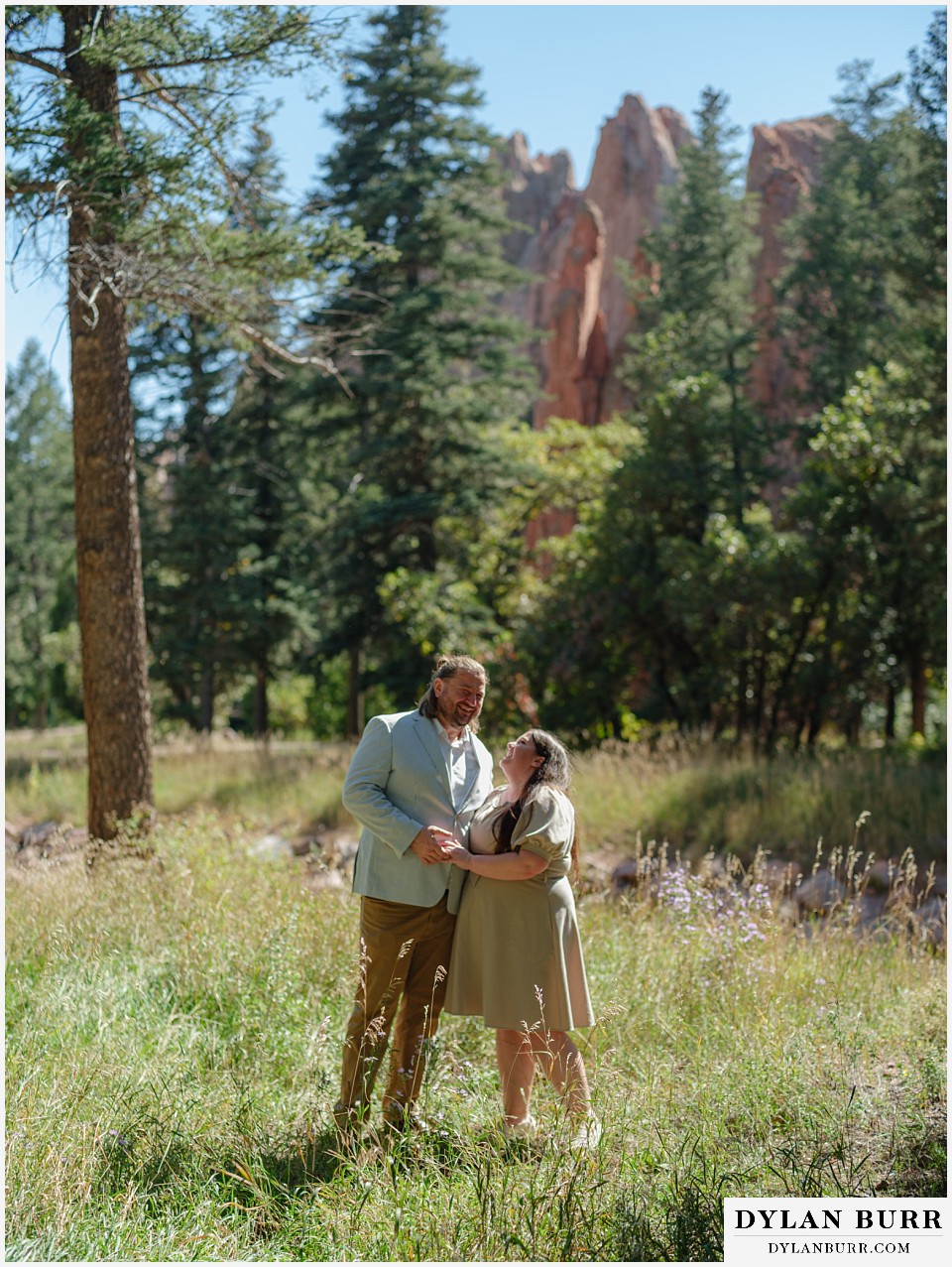 proposal at glen eyrie castle colorado springs having run with giant red rocks in background