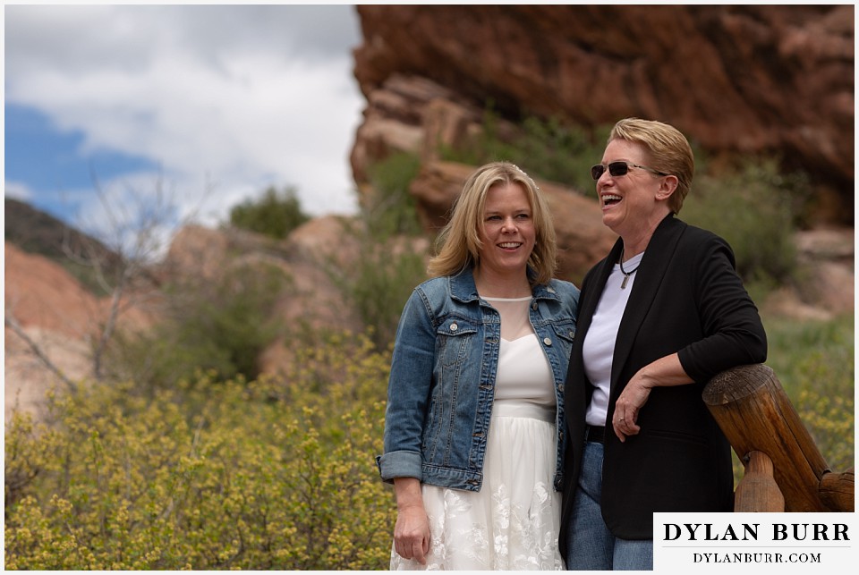 red rocks wedding morrison colorado bride laughing out loud at wife