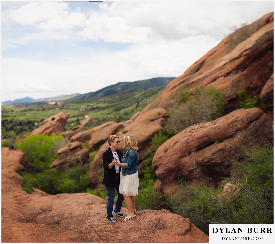 red rocks wedding morrison colorado huge rock view of lesbian couple ceremony