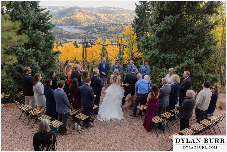 rhize weddings colorado wide view of bride walking down aisle