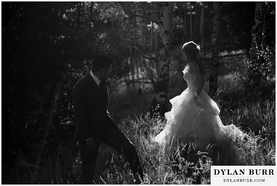 rhize weddings colorado black and white silhouette of couple in forest at sunset