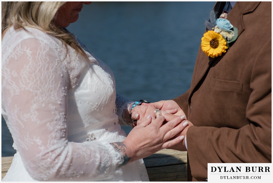 2nd chance at love rocky mountain elopement exchanging rings