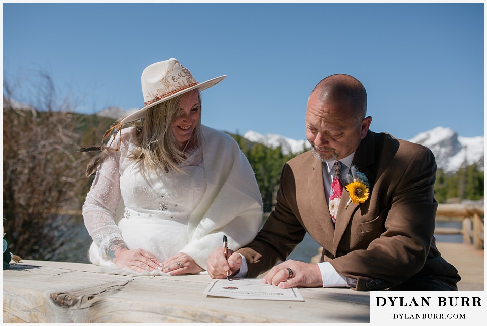 2nd chance at love rocky mountain elopement signing marriage liscense