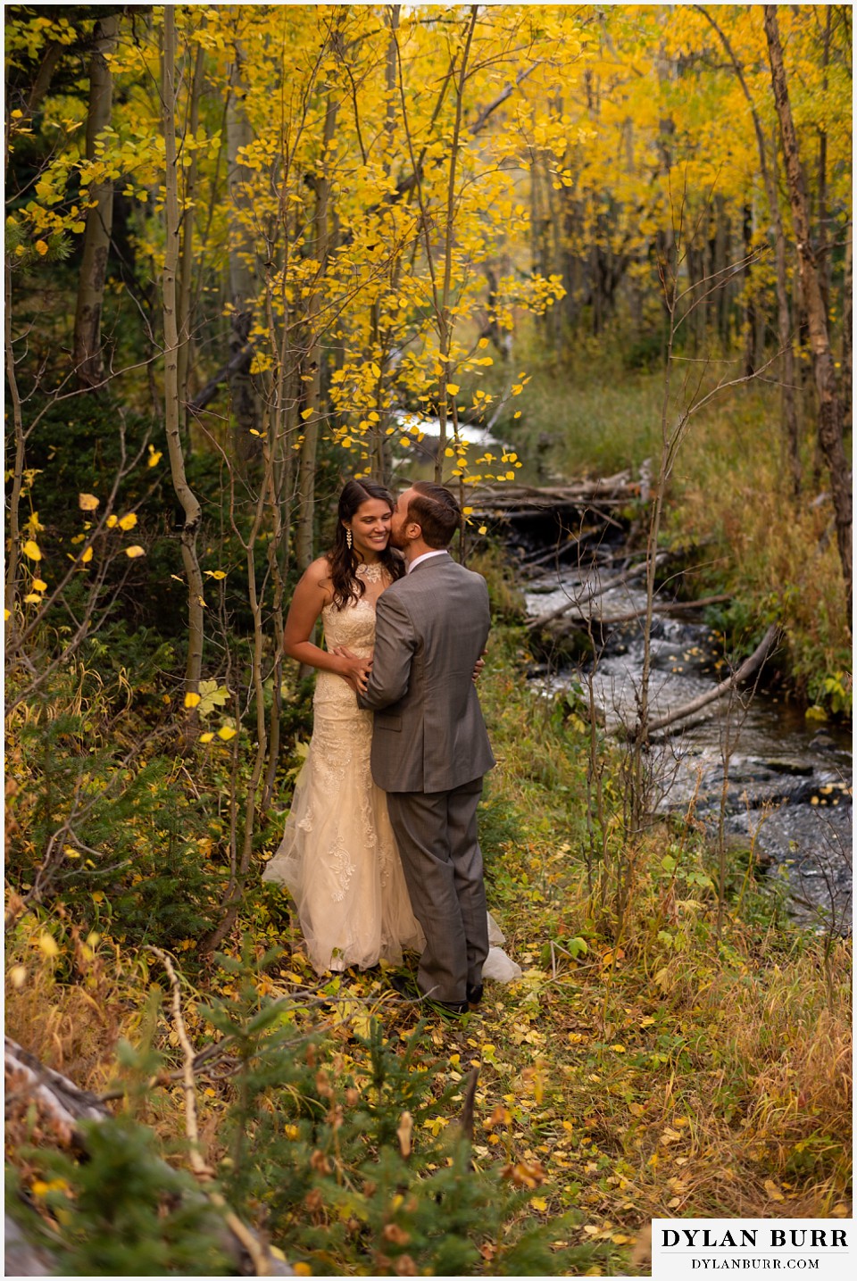 rocky mountain national park elopement wedding bride and groom along stream in fall mountains
