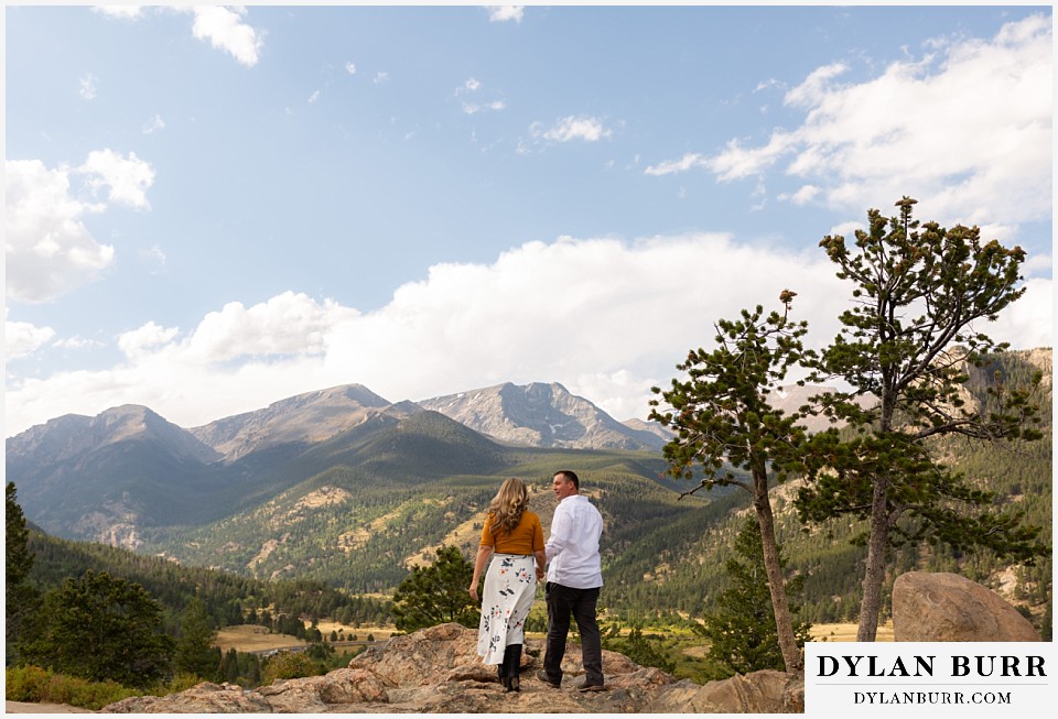 rocky mountain national park elopement wedding bride and groom reach an overlook