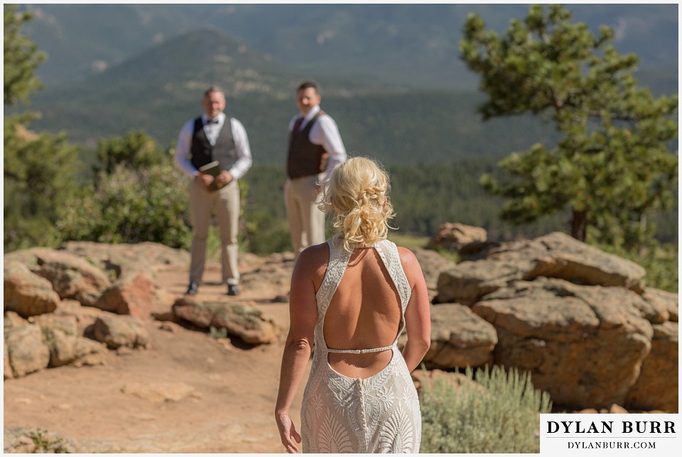rocky mountain national park wedding elopement groom looks on as the bride approaches