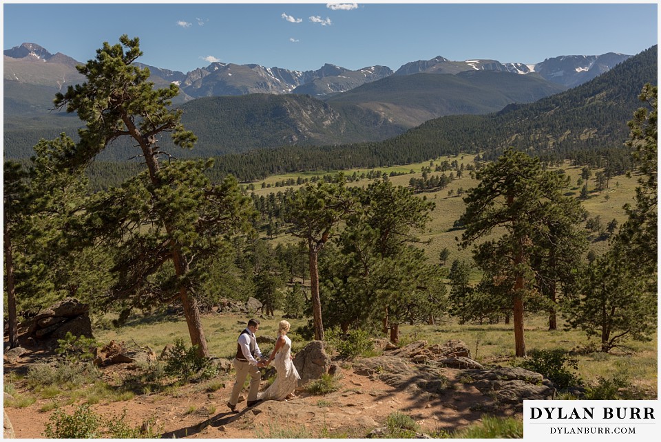 rocky mountain national park wedding elopement bride and groom walking together in the sunny mountains