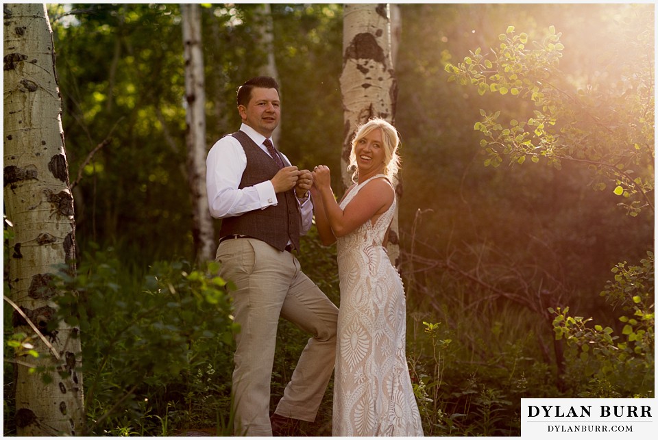 rocky mountain national park wedding elopement bride and groom laughing together