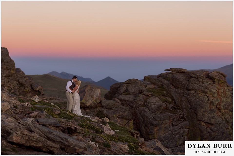 rocky mountain national park wedding elopement bride and groom kissing in rocks