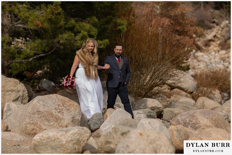 rocky mountain national park wedding elopement bride and groom hiking on large boulders