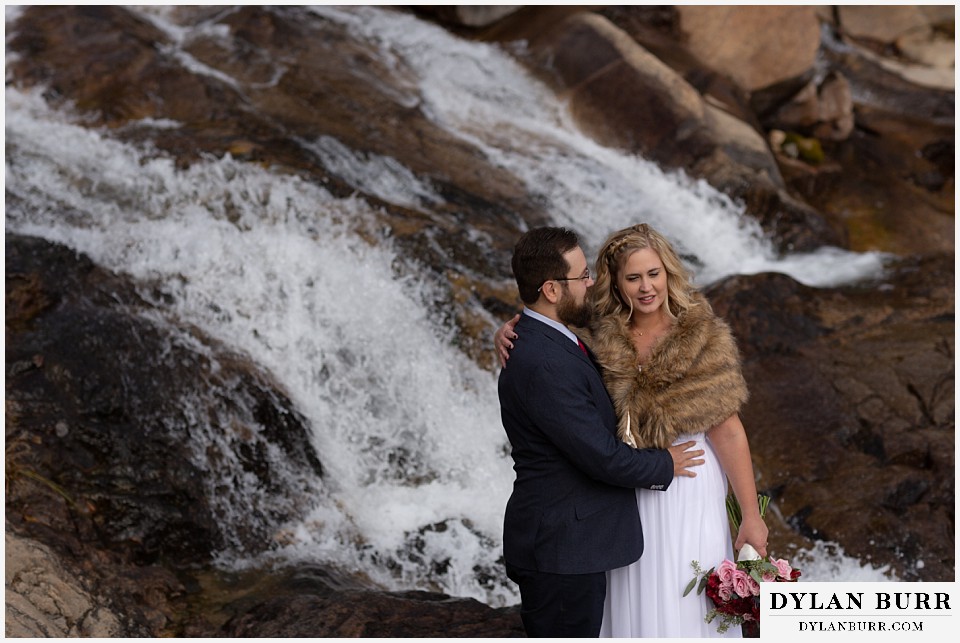 rocky mountain national park wedding elopement bride and groom at giant waterfall