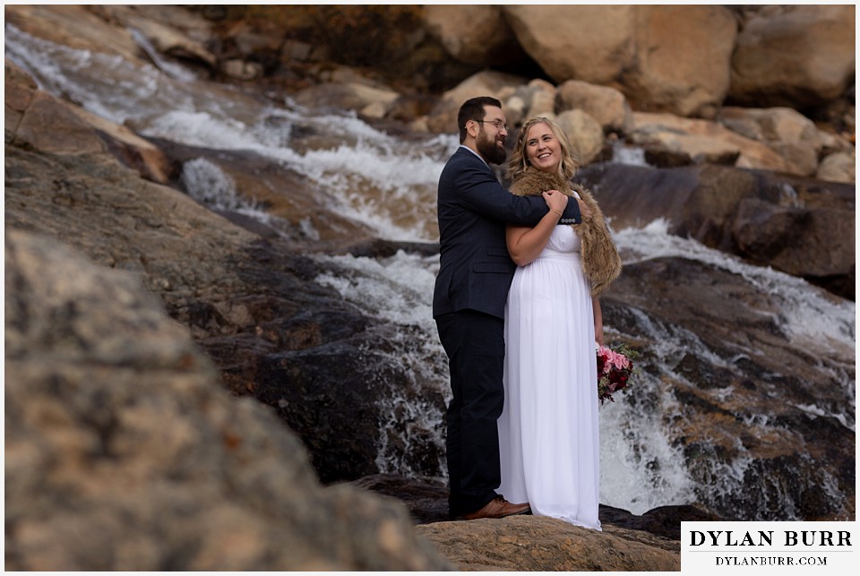 rocky mountain national park wedding elopement newlyweds near waterfall
