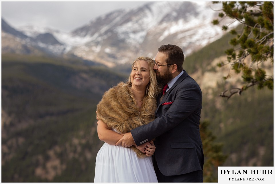 rocky mountain national park wedding elopement bride and groom snuggling together
