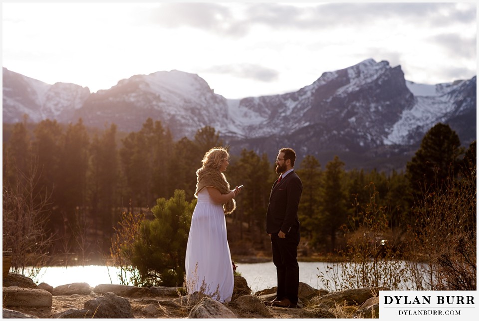 rocky mountain national park wedding elopement bride reading vows to groom