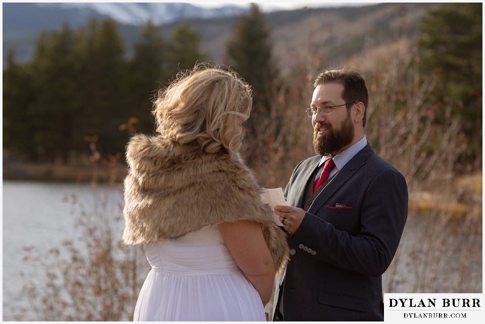 rocky mountain national park wedding elopement groom begins to read vows to his bride