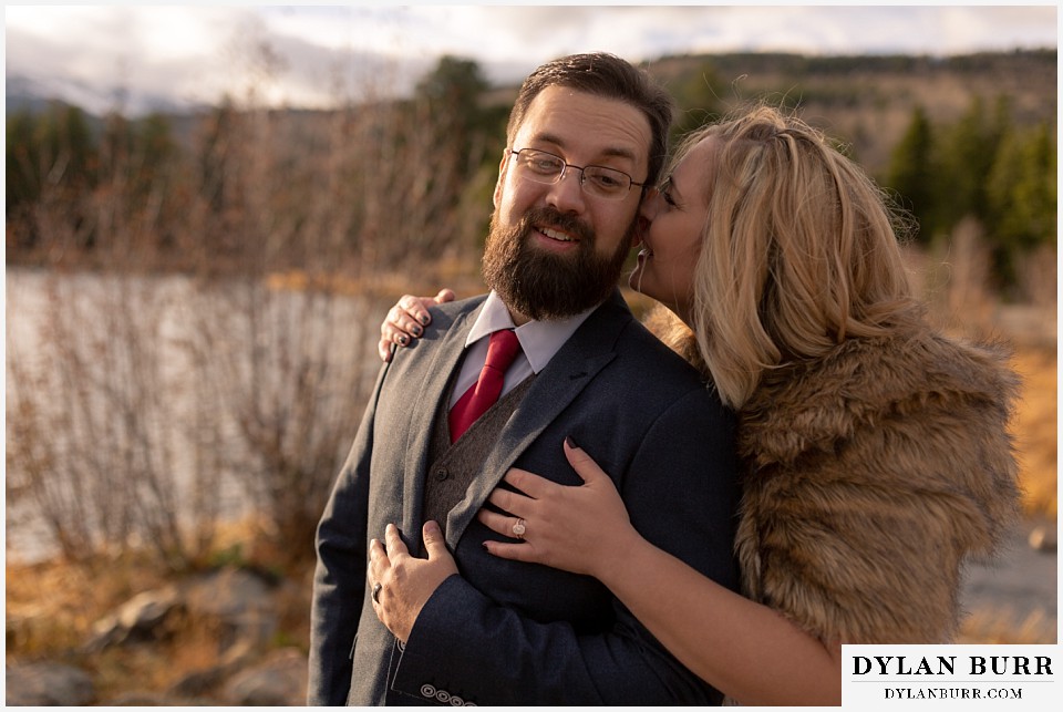 rocky mountain national park wedding elopement bride telling groom a secret