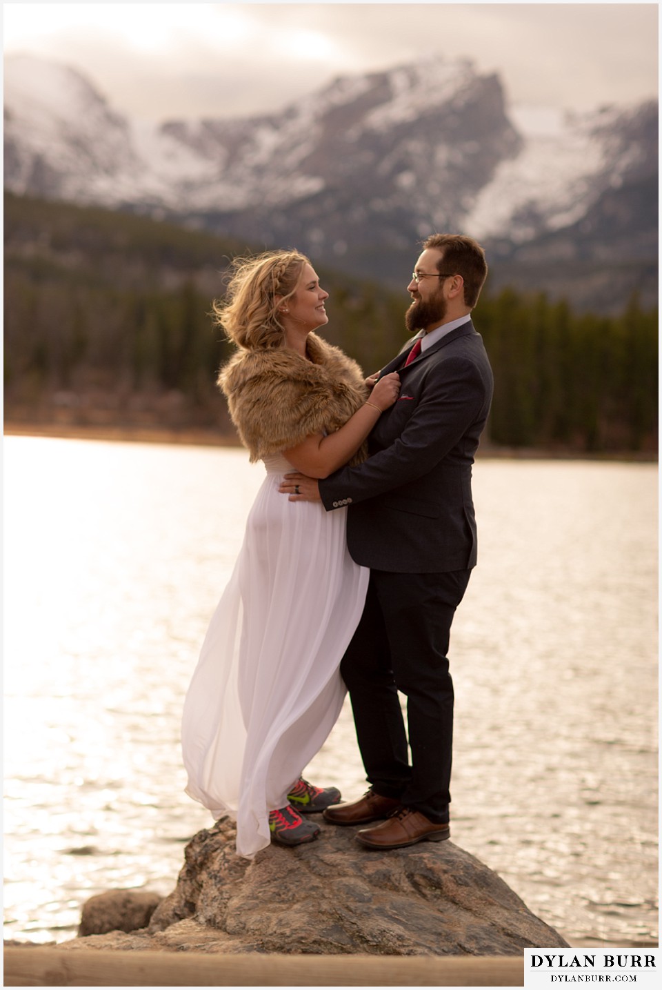 rocky mountain national park wedding elopement bride wearing hiking shoes with her groom near lake