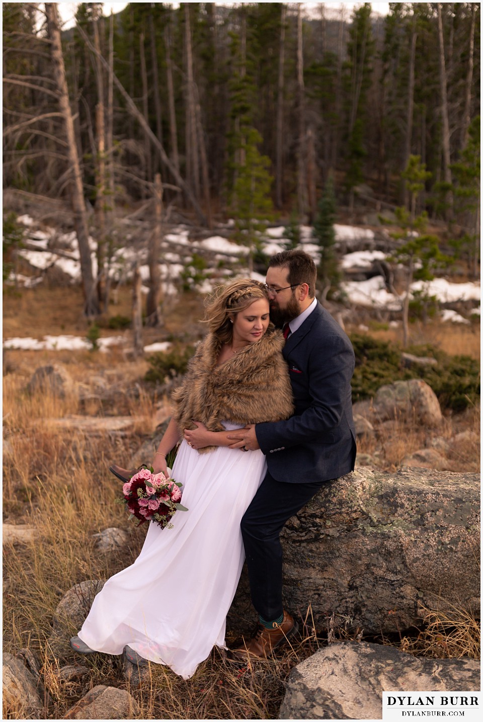rocky mountain national park wedding elopement groom whispering to his bride