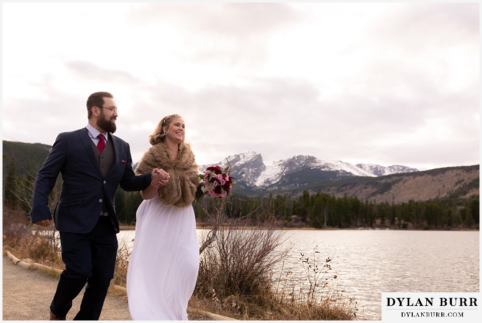 rocky mountain national park wedding elopement bride and groom having fun in mountains
