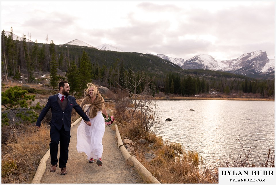rocky mountain national park wedding elopement bride adn groom trying to skip