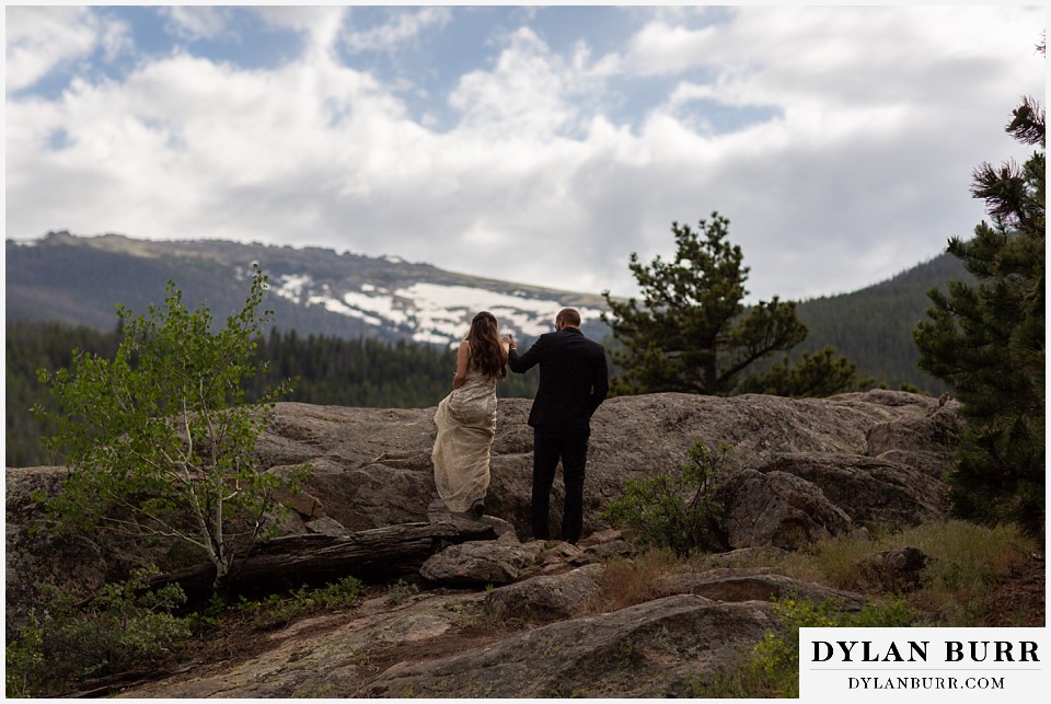 rocky mountain national park wedding elopement colorado wedding photographer dylan burr bride and groom walking together in mountains
