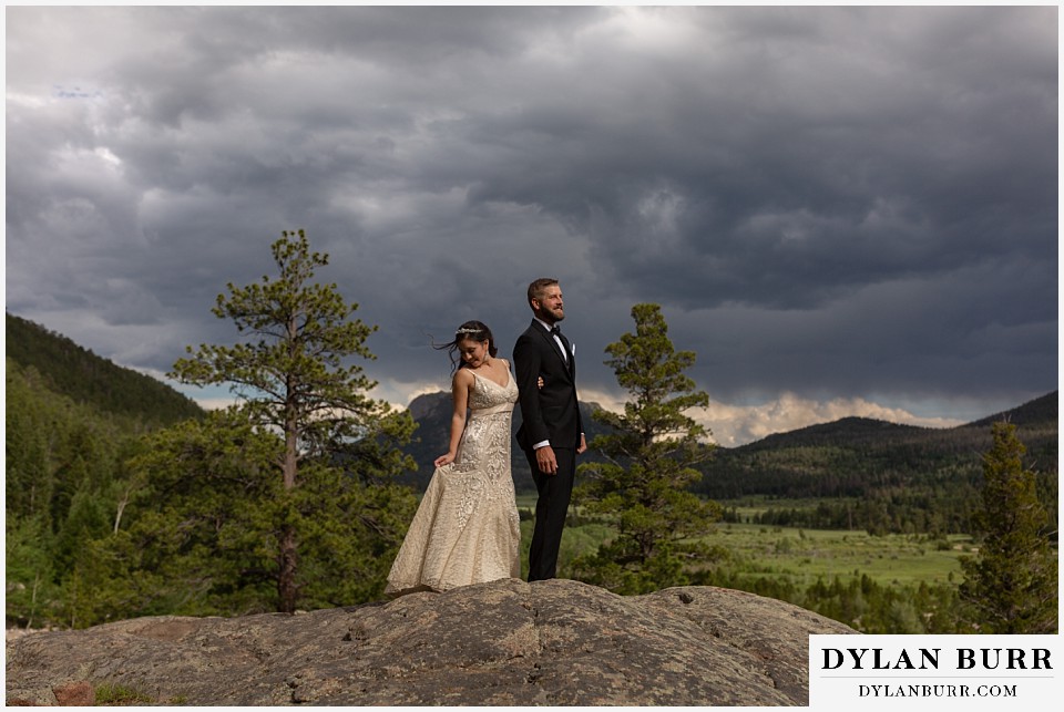 rocky mountain national park wedding elopement colorado wedding photographer dylan burr couple standing on mountain suring storm