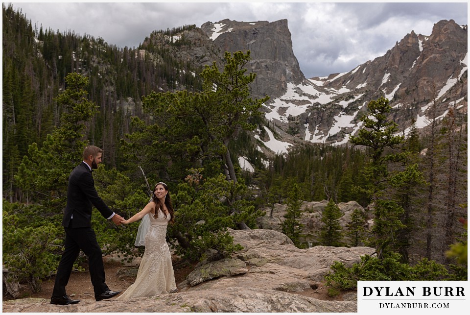 rocky mountain national park wedding elopement colorado wedding photographer dylan burr bride and groom walking together near hallet peak