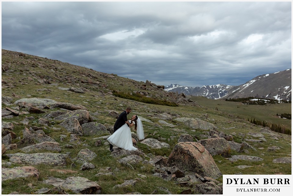 rocky mountain national park wedding elopement colorado wedding photographer dylan burr groom dipping bride on mountain tops