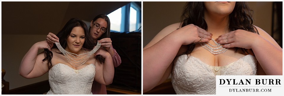 bride putting on necklace