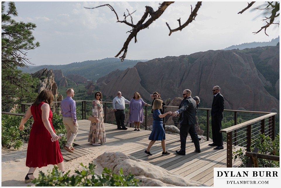 roxborough state park elopement wedding everyone coming to ceremony site