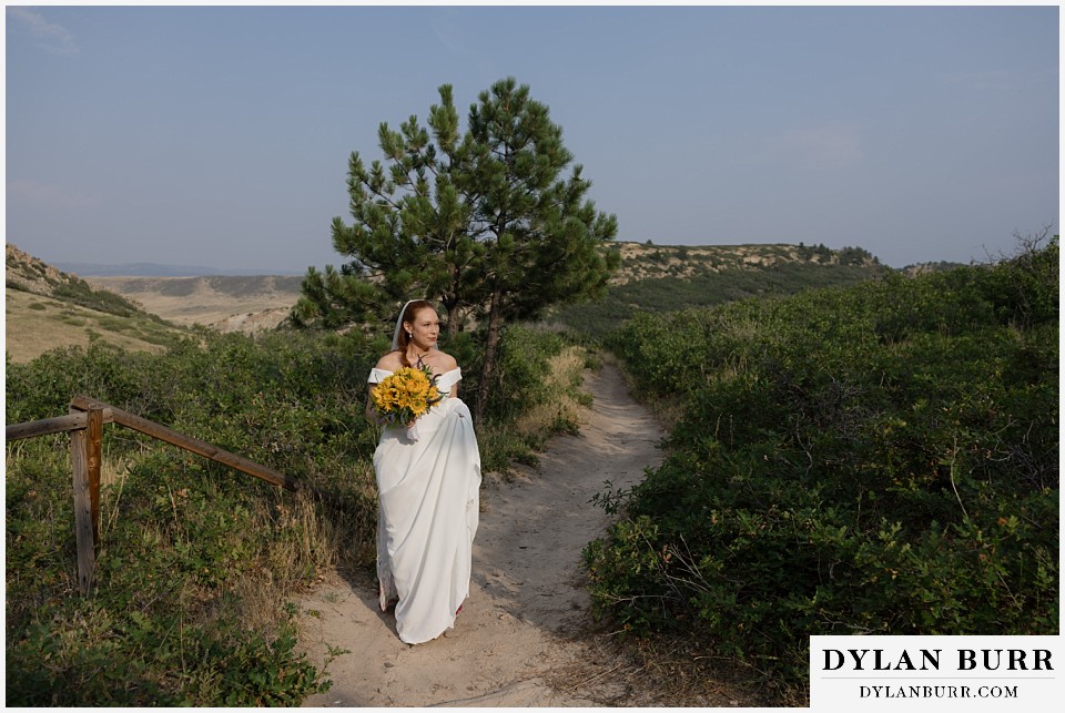 roxborough state park elopement wedding bride in the sunlight waiting for ceremony start