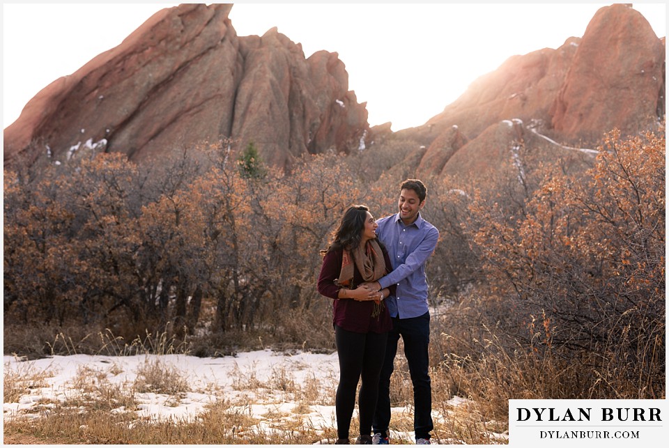 roxborough state park engagement photo session indian couple at sunset near giant rocks