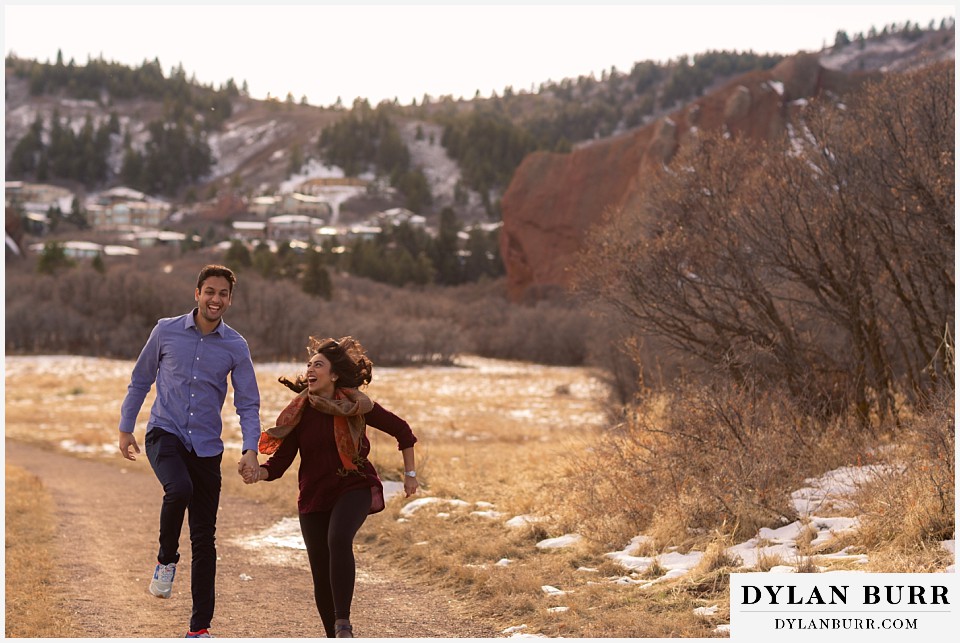 roxborough state park engagement photo session couple skipping and being silly