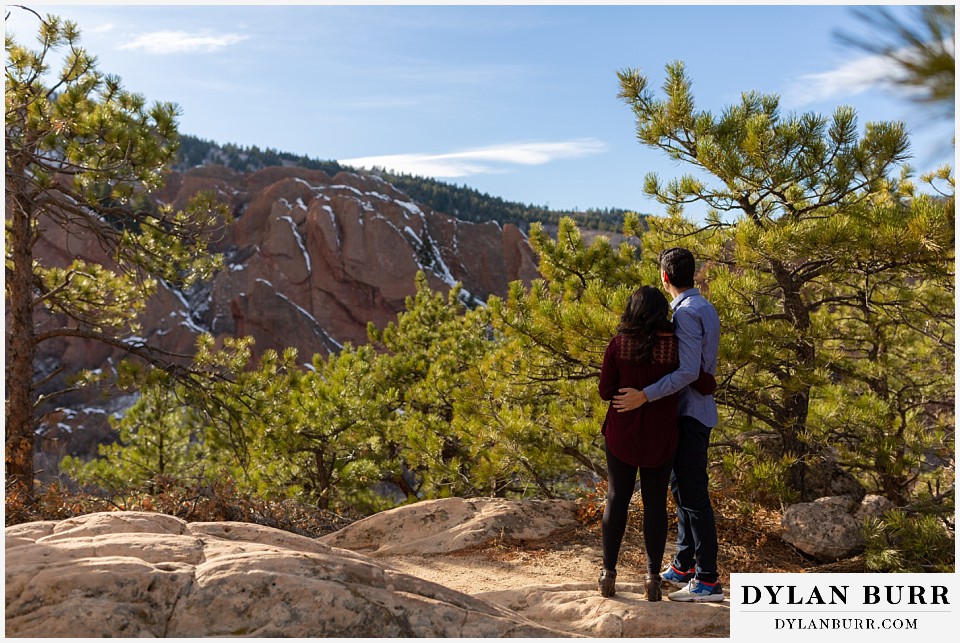 roxborough state park engagement photo session indian couple looking out over rock valley
