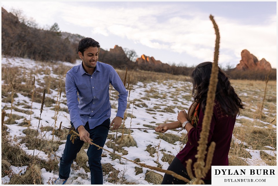 roxborough state park engagement photo session groom getting whacked with cattail