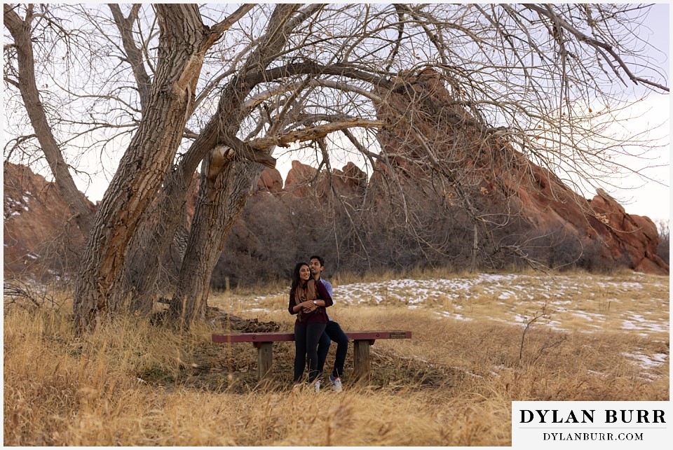 roxborough state park engagement photo session couple sitting on park bench