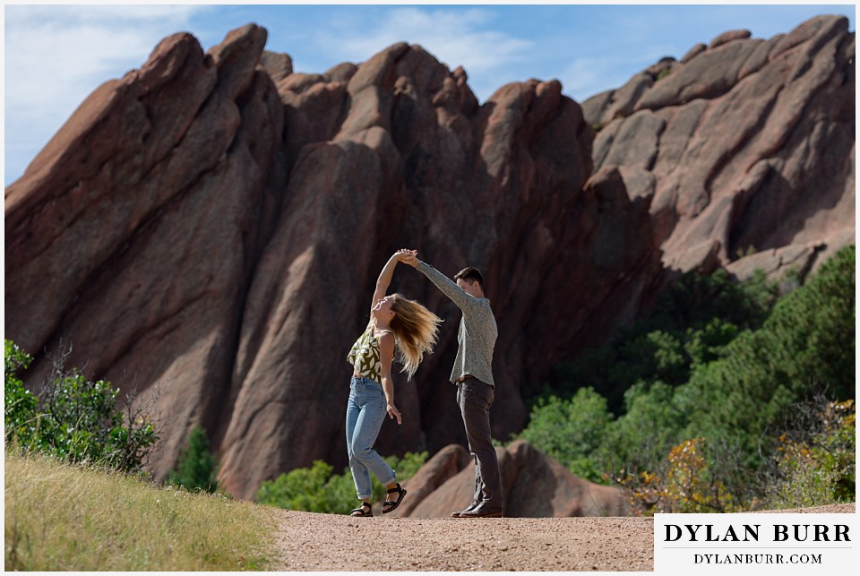 proposal in roxborough state park dancing on the walking path giant rocks in background