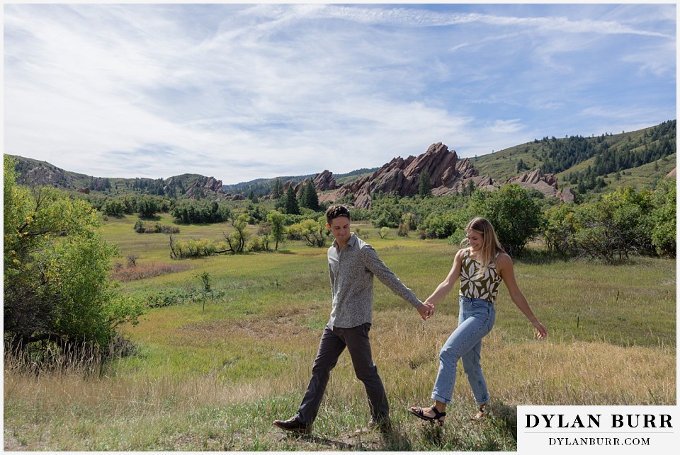 proposal in roxborough state park walking with valley in distance