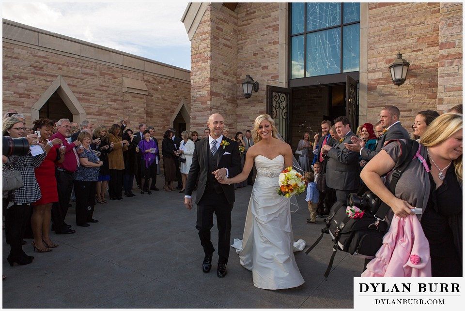 sanctuary golf course wedding bride and groom walking out of church
