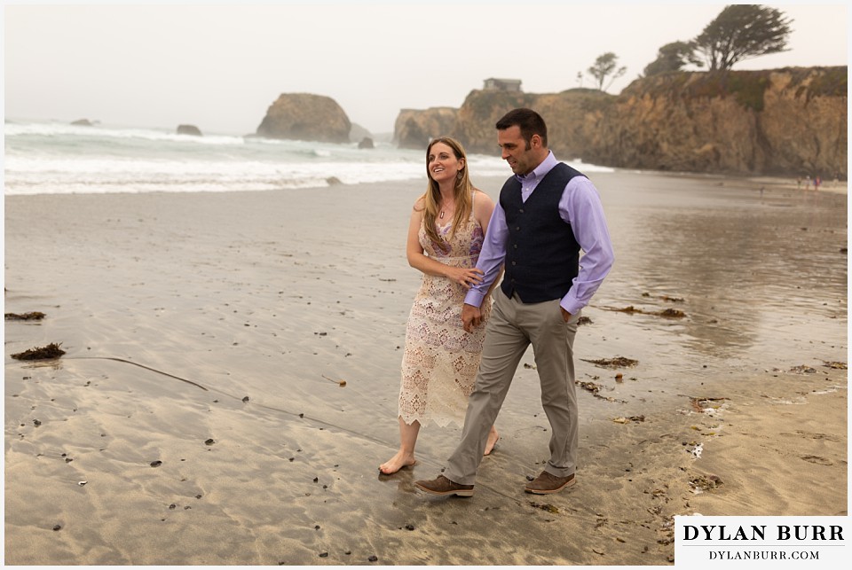 santa cruz california elopement wedding adventure bride and groom walking together in the sand